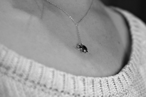 black and white image of an elephant charm on a sterling silver necklace