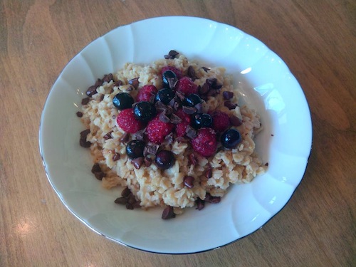 Chocolate chips and raspberries on top of oatmeal