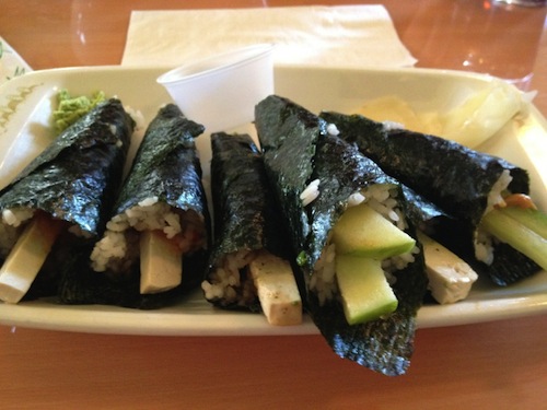 picture of 6 hand rolls of vegan sushi on a plate