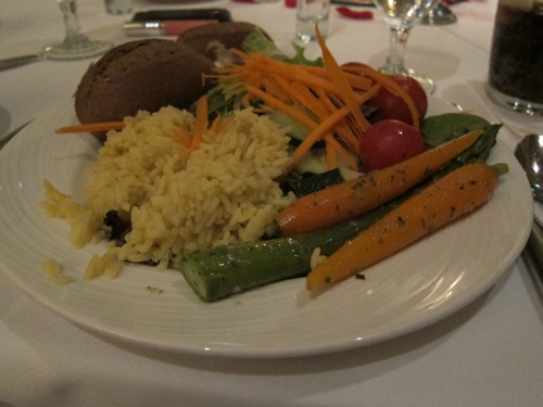 plate of grilled vegetables, rice and bread
