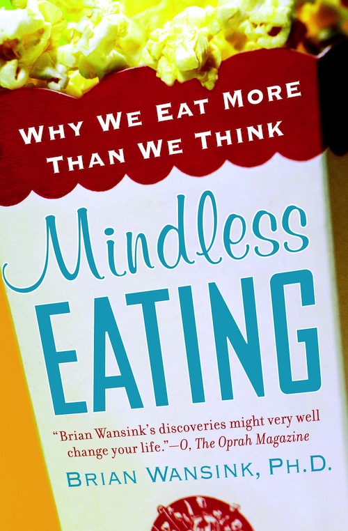 image of the book cover of Mindless Eating. It is a bag of overflowing popcorn