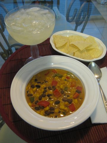 Mexican Chowder in a bowl with a margarita and chips on the side