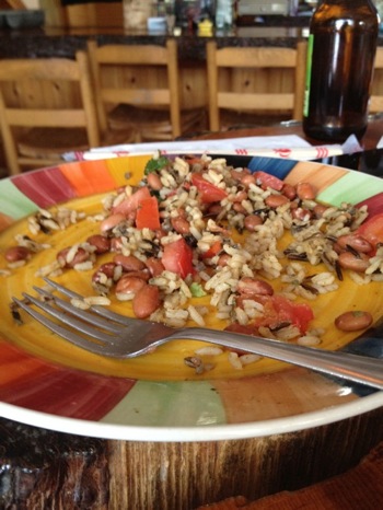 half eaten wild rice and beans on a plate